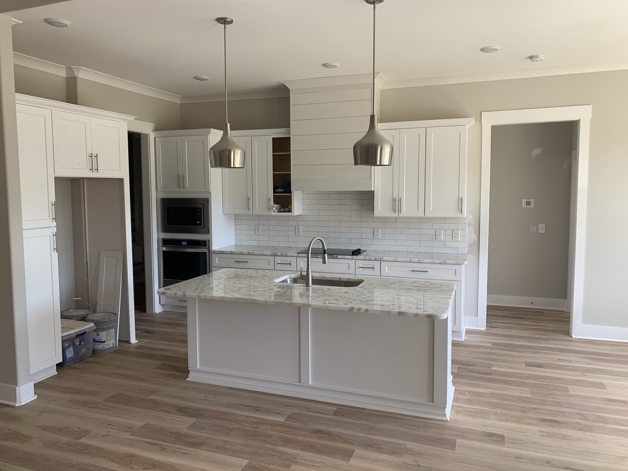 1810 Old Gallatin Road Portland, TN 37148 - Photo 4 of 52 a kitchen with kitchen island a counter top space a sink a refrigerator and cabinets