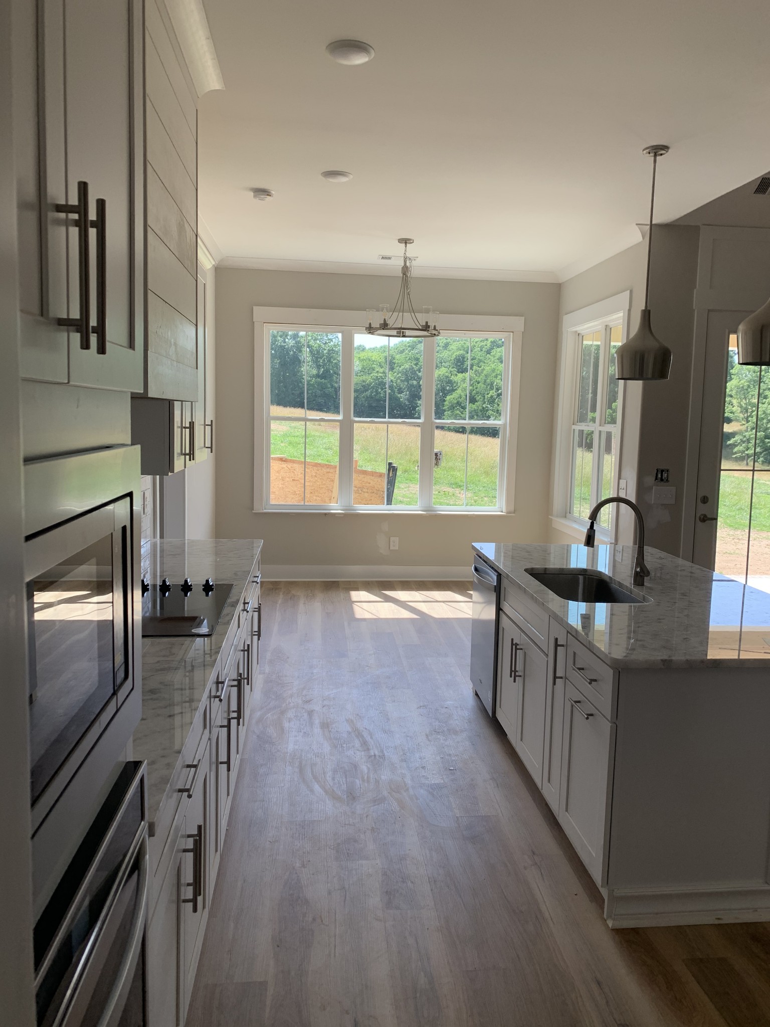 1810 Old Gallatin Road Portland, TN 37148 - Photo 9 of 52 a large kitchen with granite countertop a stove a sink a refrigerator and a fireplace