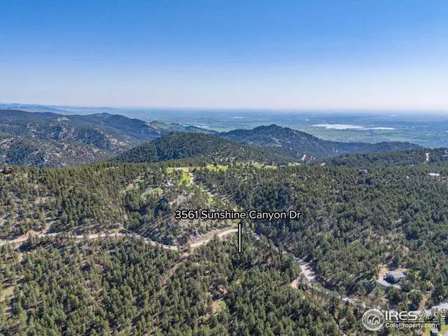 an aerial view of residential house and green space