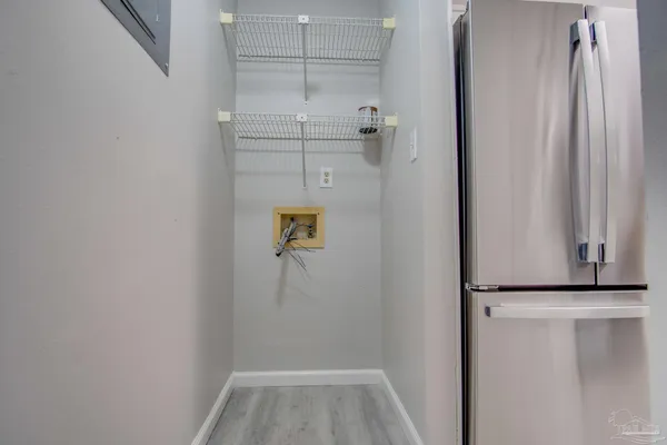 a view of walk in closet with empty racks