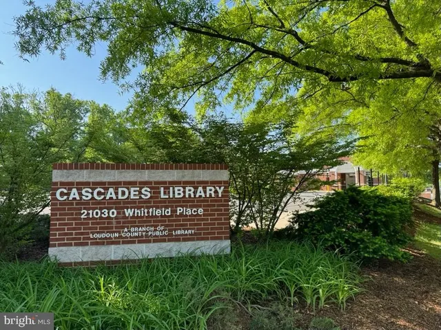 a front view of building with sign board