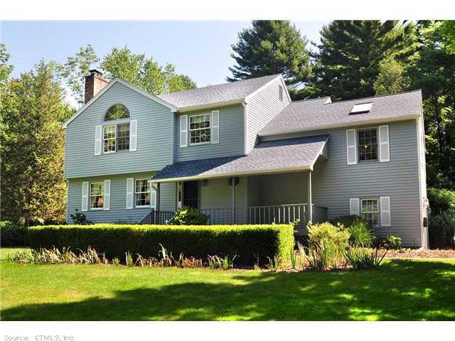 260 Waterville Road Avon, CT 06001 - Photo 1 of 1 a front view of a house with a garden and plants