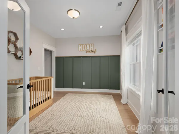 a view of a hallway with a bedroom
