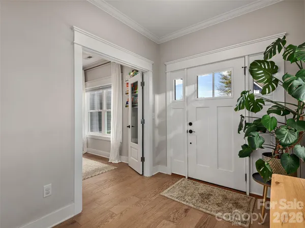 a view of entryway with wooden floor