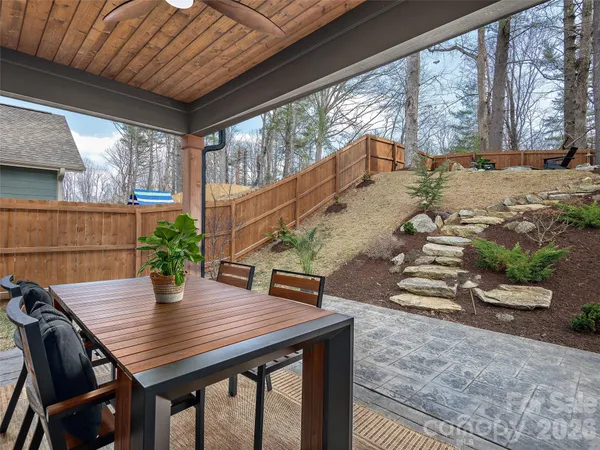 a outdoor dining space with furniture and outdoor view
