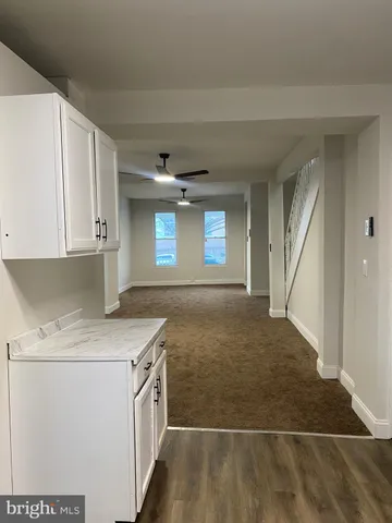 a view of a kitchen cabinets a sink and dishwasher