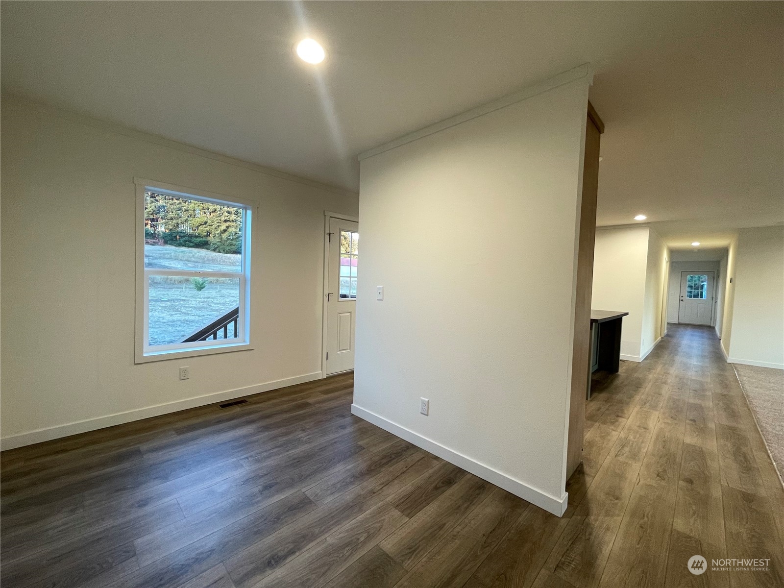230 Bunker Creek Road Chehalis, WA 98532 - Photo 4 of 19 an empty room with wooden floor and windows