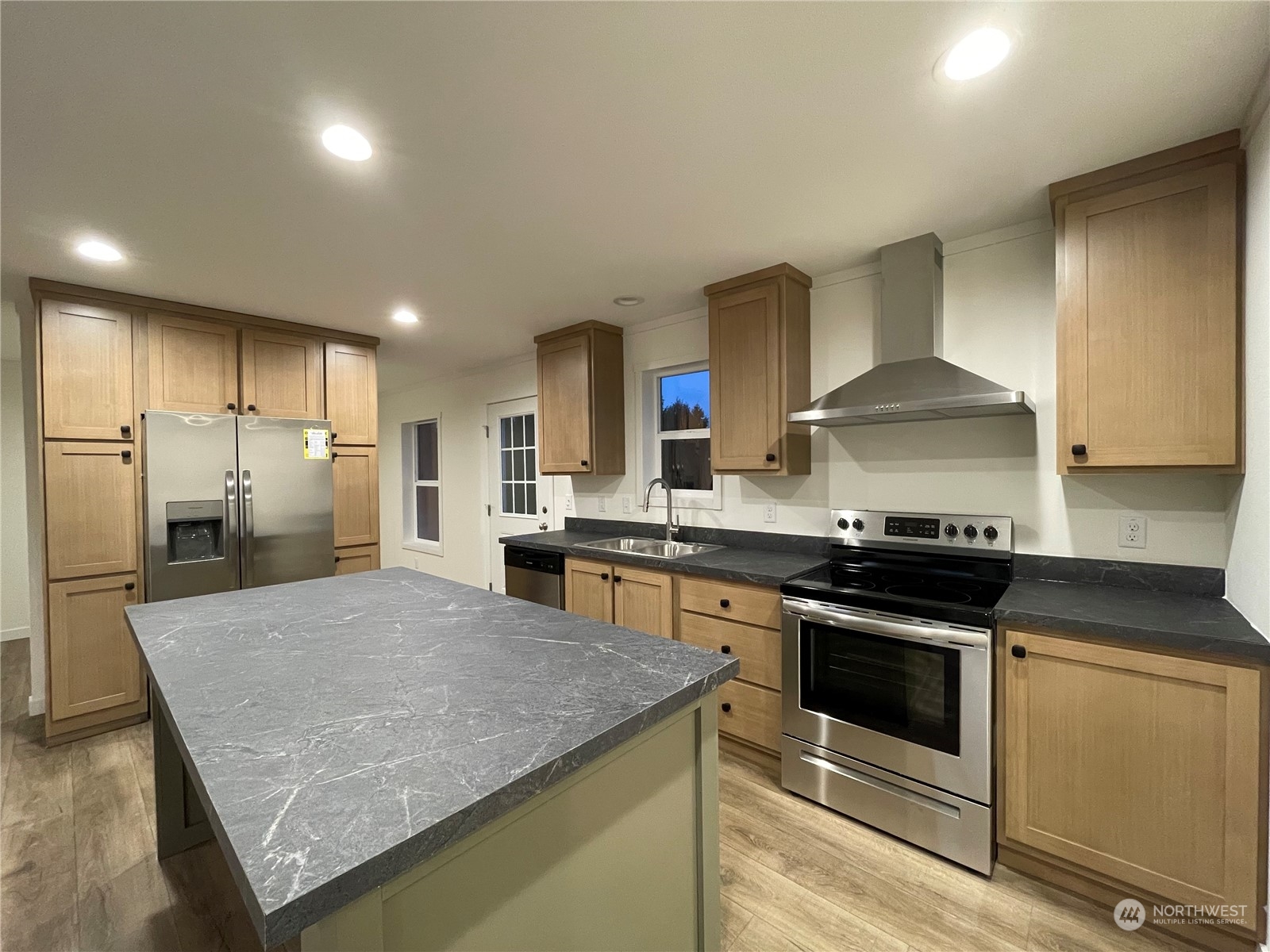 230 Bunker Creek Road Chehalis, WA 98532 - Photo 5 of 19 a kitchen with stainless steel appliances granite countertop a stove a sink and a refrigerator