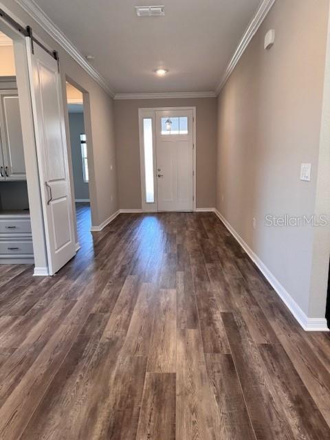 10390 Southwest 99th Street Ocala, FL 34481 - Photo 11 of 48 a view of an empty room with wooden floor and a window