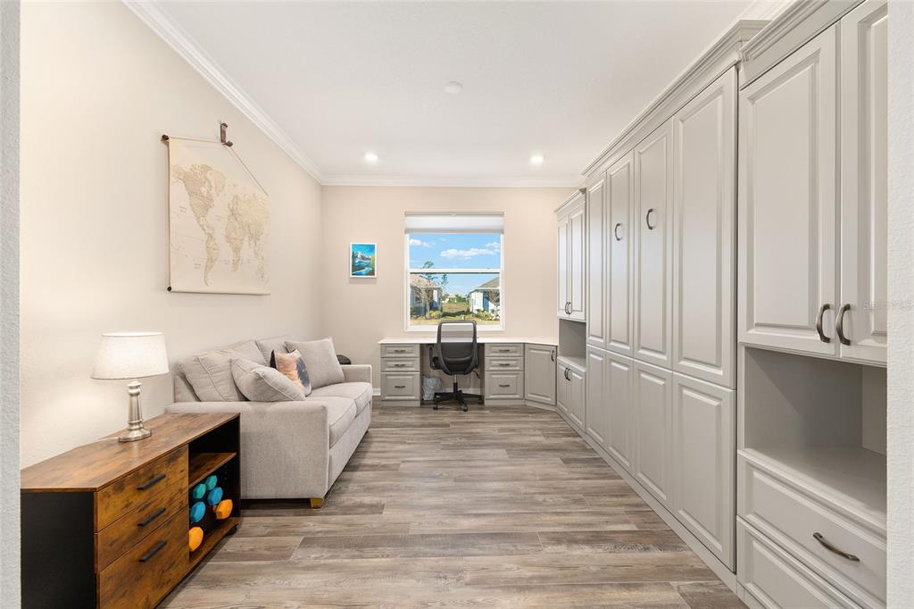 10390 Southwest 99th Street Ocala, FL 34481 - Photo 15 of 48 a living room with furniture and a wooden floor