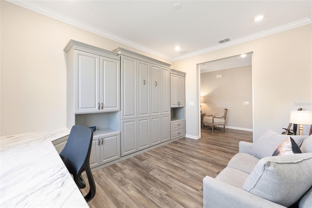 10390 Southwest 99th Street Ocala, FL 34481 - Photo 16 of 48 a living room with furniture and a table