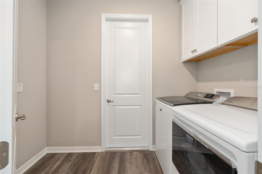 10390 Southwest 99th Street Ocala, FL 34481 - Photo 25 of 48 a utility room with dryer and washer