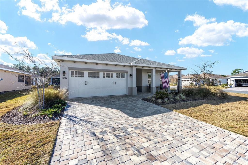 10390 Southwest 99th Street Ocala, FL 34481 - Photo 3 of 48 a view of a house with a patio