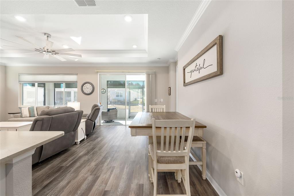 10390 Southwest 99th Street Ocala, FL 34481 - Photo 33 of 48 a living room with furniture and a wooden floor
