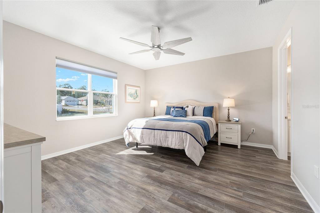 10390 Southwest 99th Street Ocala, FL 34481 - Photo 36 of 48 a bedroom with a bed and a window