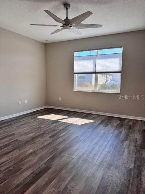 10390 Southwest 99th Street Ocala, FL 34481 - Photo 37 of 48 an empty room with wooden floor fan and windows