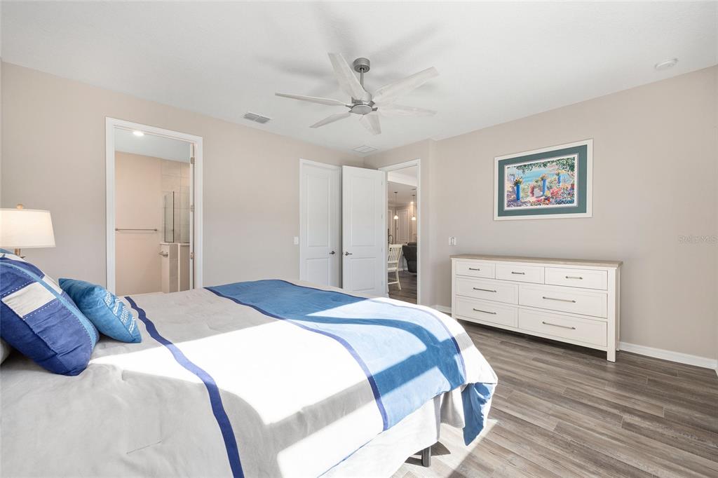 10390 Southwest 99th Street Ocala, FL 34481 - Photo 39 of 48 a bedroom with a bed and a dresser