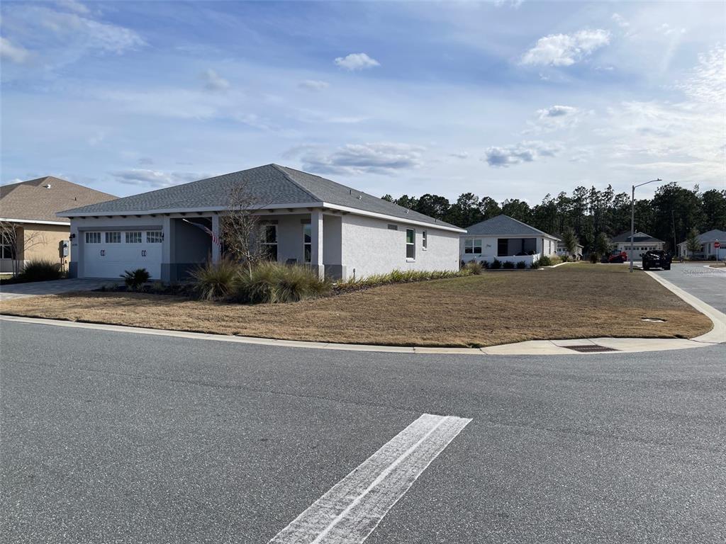 10390 Southwest 99th Street Ocala, FL 34481 - Photo 4 of 48 a view of a house with a outdoor space