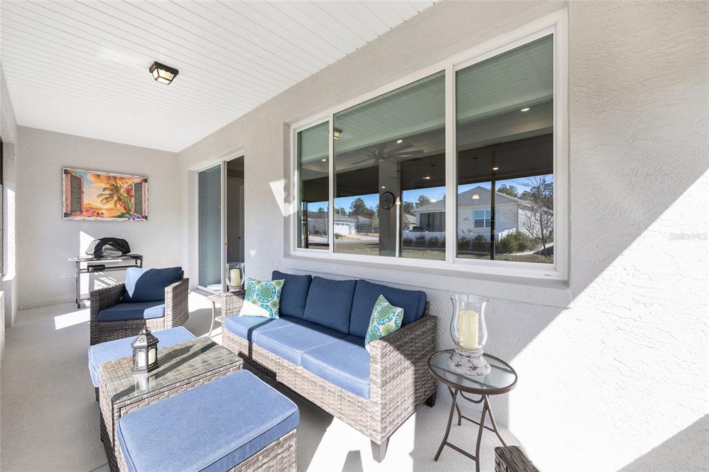10390 Southwest 99th Street Ocala, FL 34481 - Photo 42 of 48 a living room with furniture and a large window