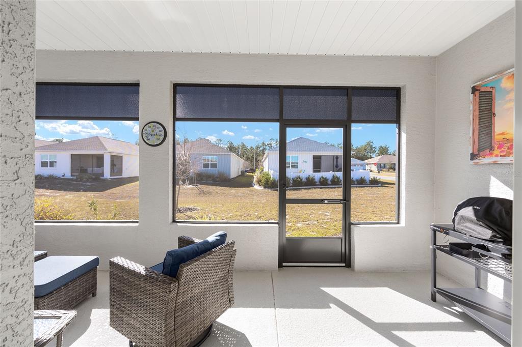10390 Southwest 99th Street Ocala, FL 34481 - Photo 43 of 48 a living room with furniture and a large window