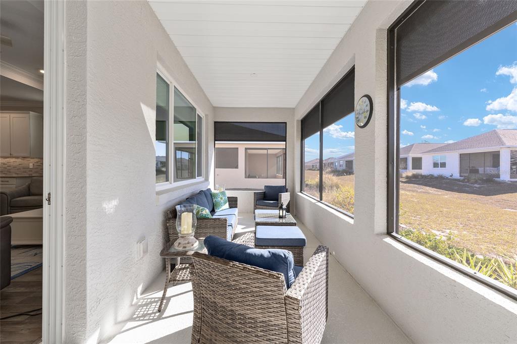 10390 Southwest 99th Street Ocala, FL 34481 - Photo 46 of 48 a living room with furniture and a large window