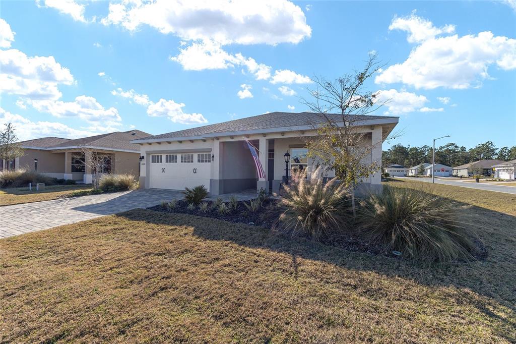 10390 Southwest 99th Street Ocala, FL 34481 - Photo 5 of 48 a view of a house with backyard and sitting area