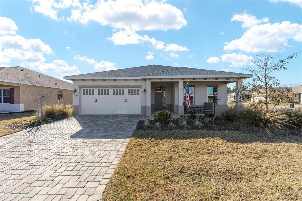 10390 Southwest 99th Street Ocala, FL 34481 - Photo 6 of 48 a view of a house with backyard and sitting area
