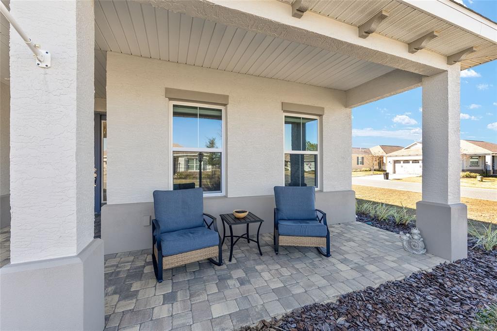 10390 Southwest 99th Street Ocala, FL 34481 - Photo 7 of 48 a living room with furniture and a potted plant