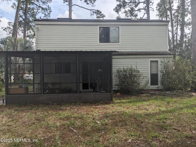 a view of a yard with a tree