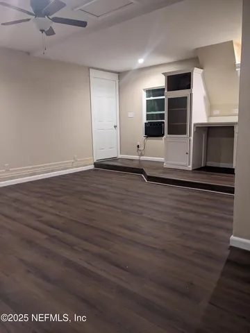 a room with furniture a piano and wooden floor