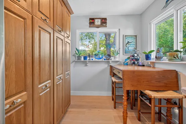 a bathroom with a sink vanity mirror and toilet