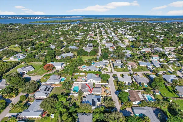 an aerial view of a house with a yard