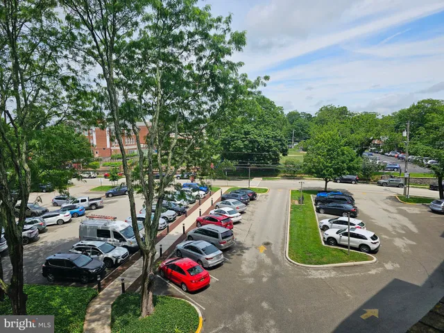 swimming pool view with a seating space