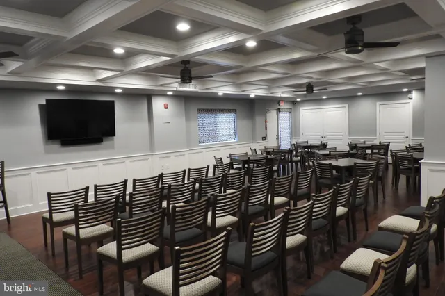 a work room with furniture and a book shelf