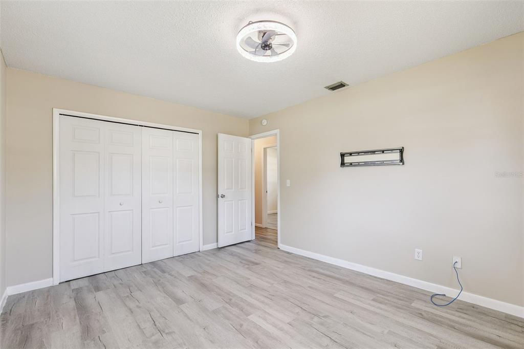 111 Amigos Road DeBary, FL 32713 - Photo 12 of 29 a view of a room with wooden floor
