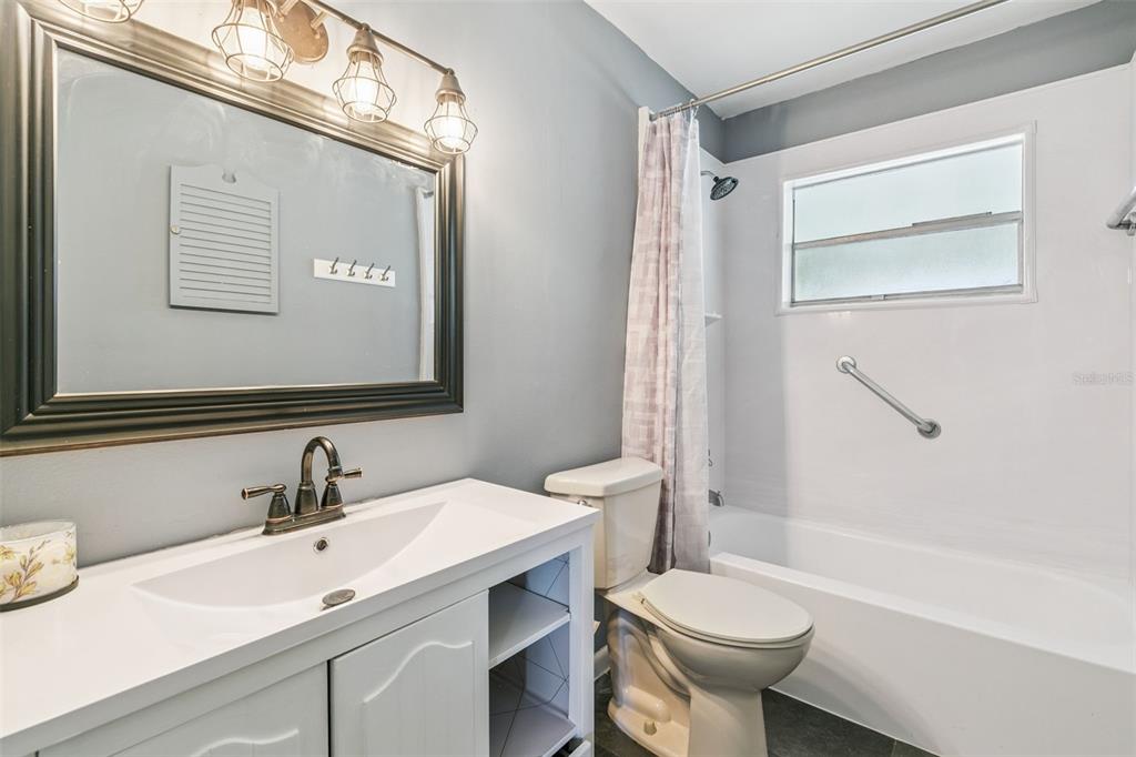 111 Amigos Road DeBary, FL 32713 - Photo 18 of 29 a bathroom with a sink toilet and shower