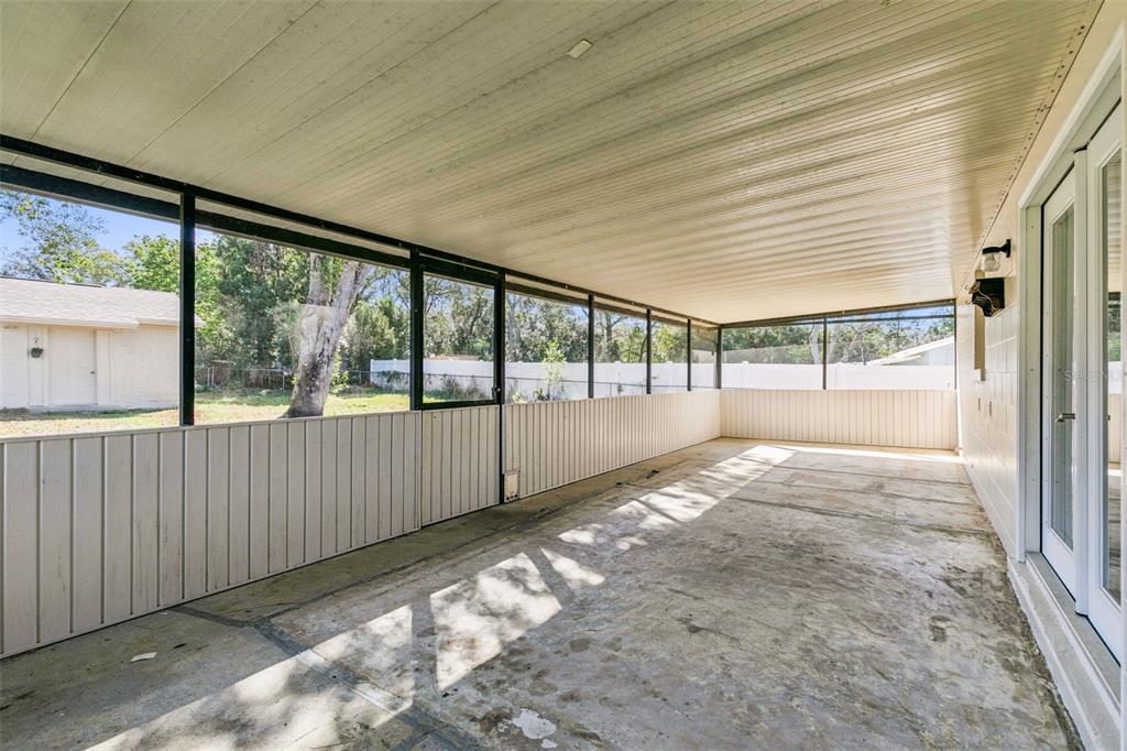 111 Amigos Road DeBary, FL 32713 - Photo 22 of 29 a view of an empty room with a large window