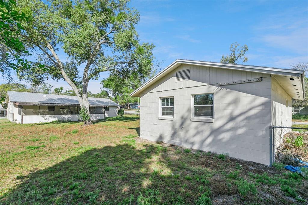 111 Amigos Road DeBary, FL 32713 - Photo 23 of 29 a view of a backyard with large trees