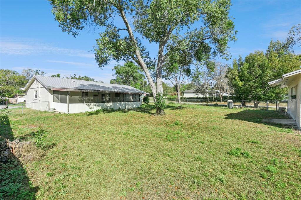 111 Amigos Road DeBary, FL 32713 - Photo 24 of 29 a view of a house with a yard