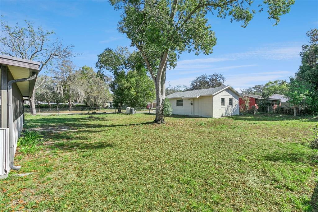 111 Amigos Road DeBary, FL 32713 - Photo 26 of 29 a front view of a house with a yard