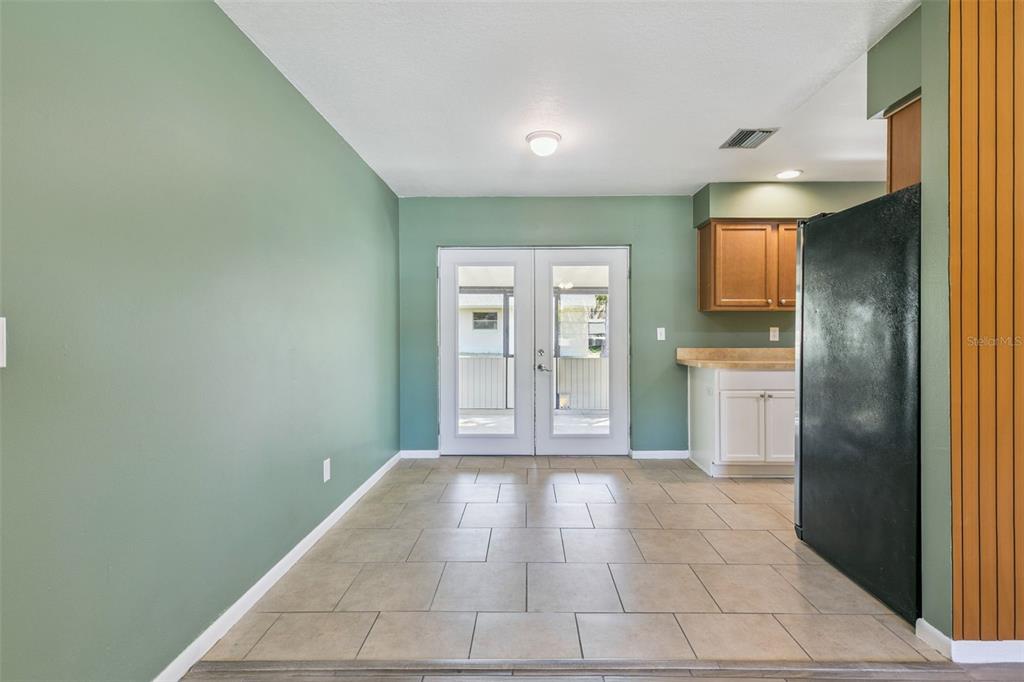 111 Amigos Road DeBary, FL 32713 - Photo 7 of 29 a view of a kitchen with a refrigerator and a sink