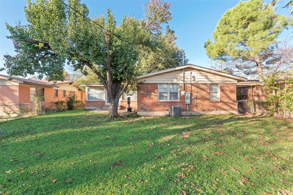 11310 Sinclair Avenue Dallas, TX 75218 - Photo 24 of 26 a view of a house with a yard