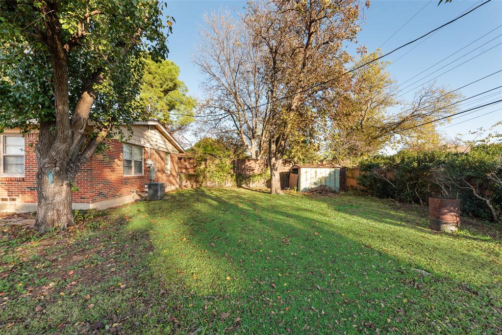 11310 Sinclair Avenue Dallas, TX 75218 - Photo 25 of 26 a front view of a house with a yard