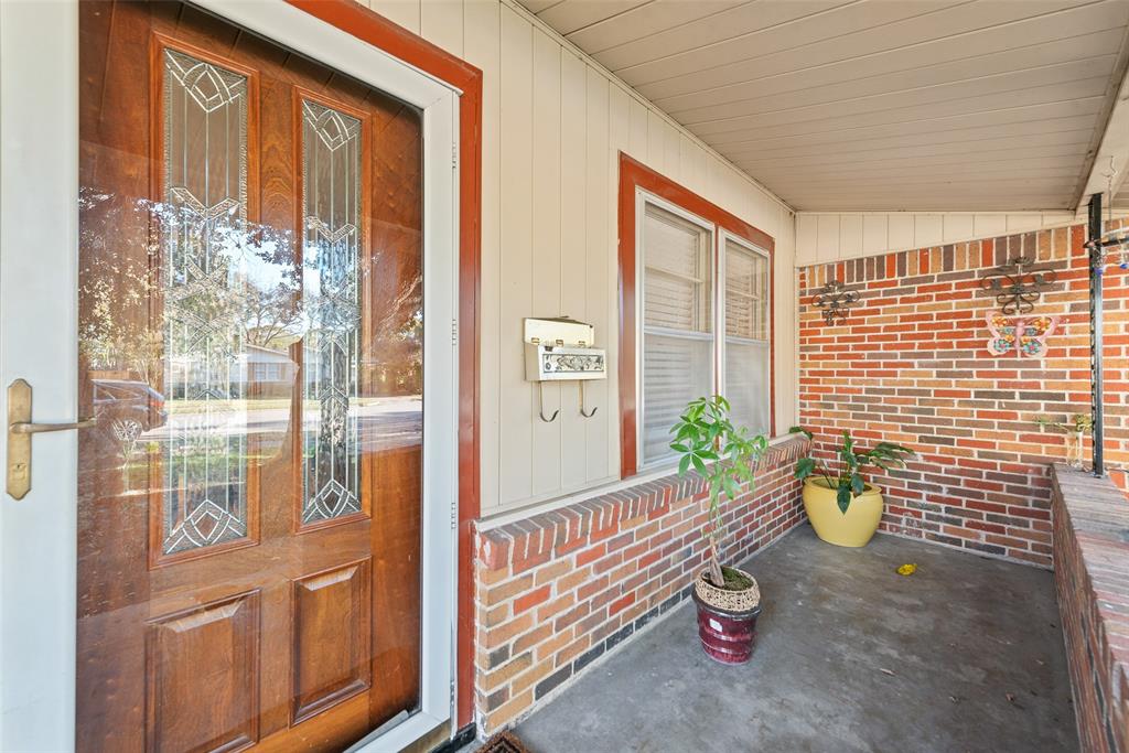 11310 Sinclair Avenue Dallas, TX 75218 - Photo 3 of 26 a view of a porch with chairs and potted plants