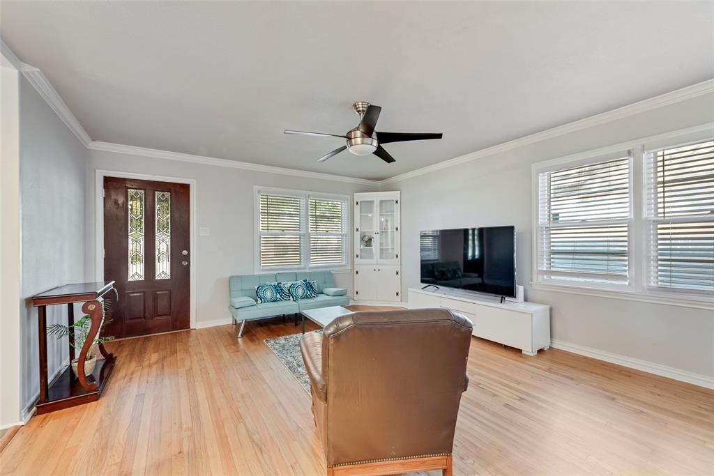 11310 Sinclair Avenue Dallas, TX 75218 - Photo 4 of 26 a living room with furniture and a flat screen tv