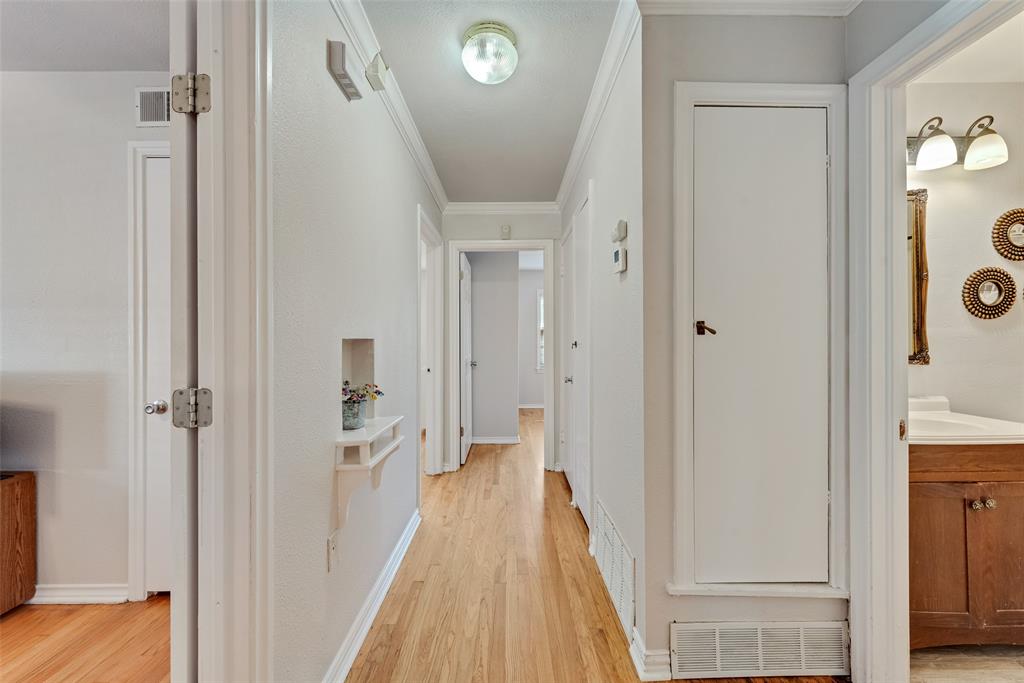 11310 Sinclair Avenue Dallas, TX 75218 - Photo 5 of 26 a view of a bathroom from the hallway