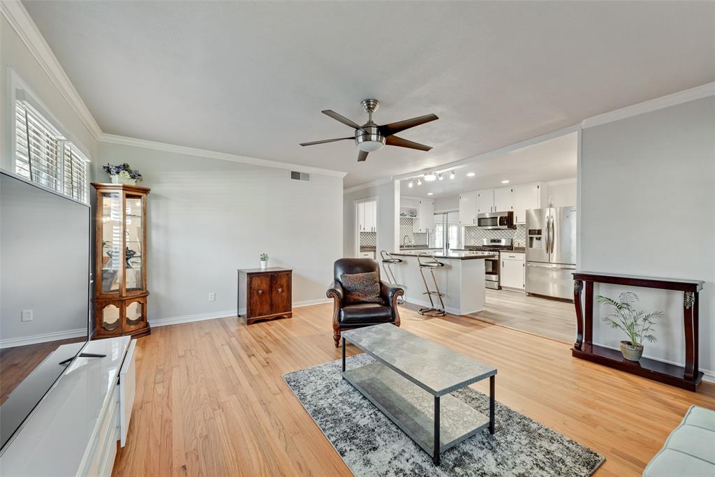 11310 Sinclair Avenue Dallas, TX 75218 - Photo 6 of 26 a living room with furniture and kitchen view