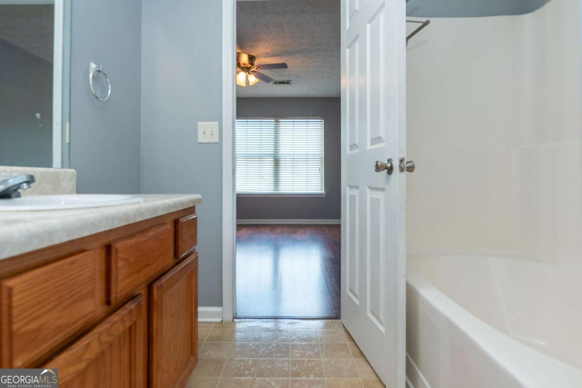4123 Stone Trace Drive East Point, GA 30344 - Photo 14 of 24 a bathroom with a sink and a tub