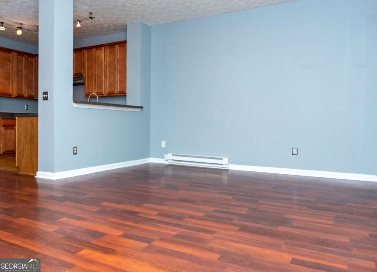 4123 Stone Trace Drive East Point, GA 30344 - Photo 17 of 24 a view of empty room with wooden floor and fan
