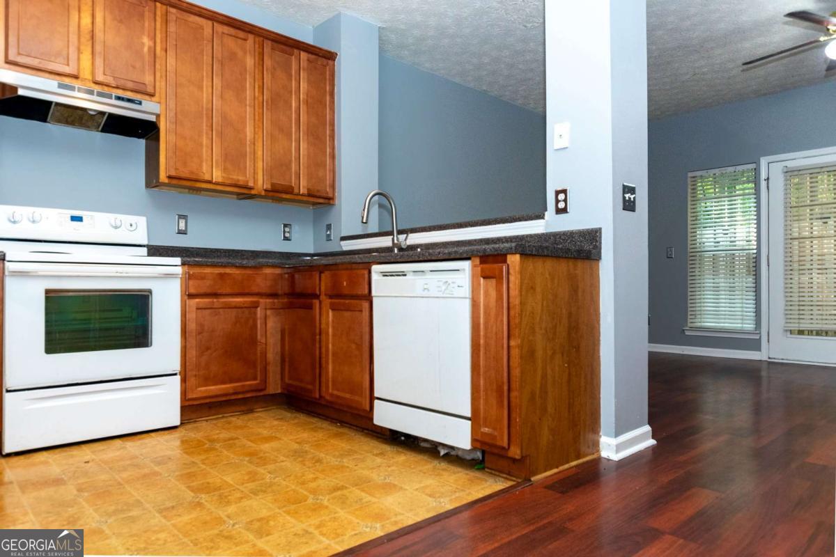 4123 Stone Trace Drive East Point, GA 30344 - Photo 18 of 24 a view of a kitchen with wooden floor and electronic appliances